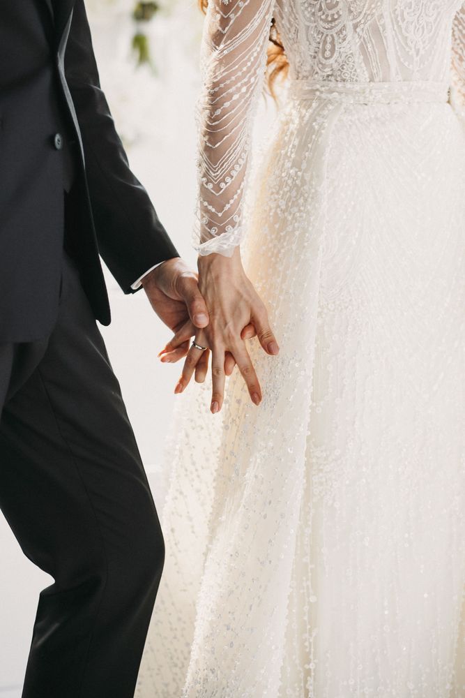 wedding-couple-hold-hands.jpg